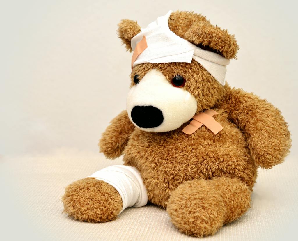 a teddy bear is injured
